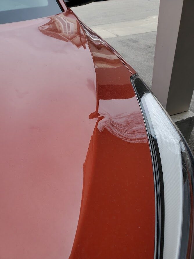 Neighbour's recycling bin lid hit dented my car - opinions